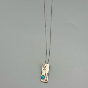 Sterling silver necklace with turquoise stone pendant